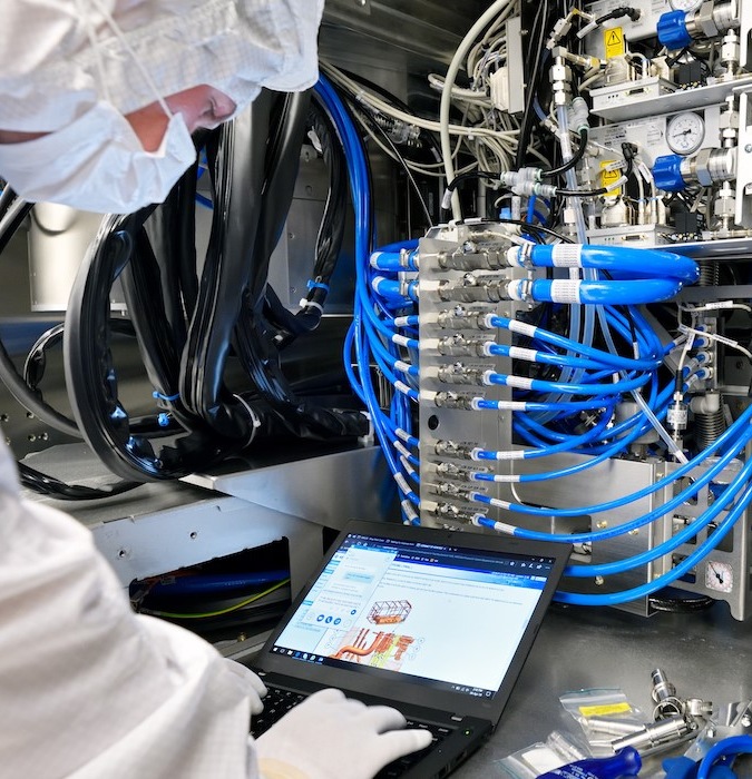 Employee working with a machine at ASML in Eindhoven